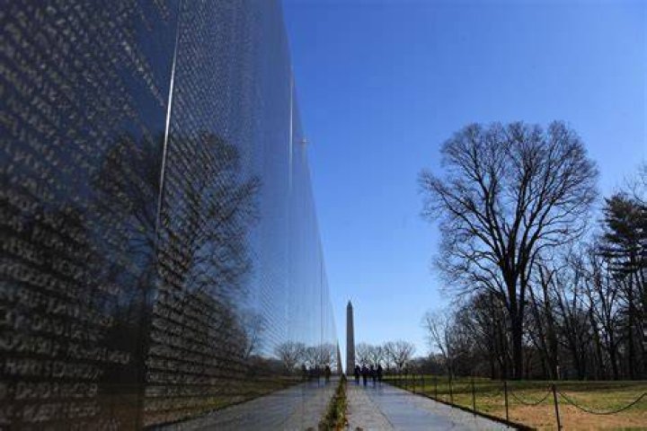 What do the symbols mean on the Vietnam Wall?